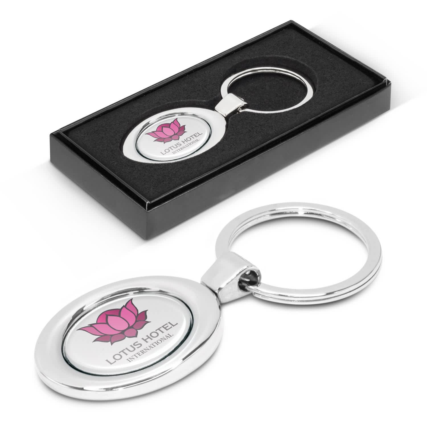 An oval metal key ring featuring a lotus flower design and the text "LOTUS HOTEL" presented in a black gift box. Oval Metal Key Ring - Image 1