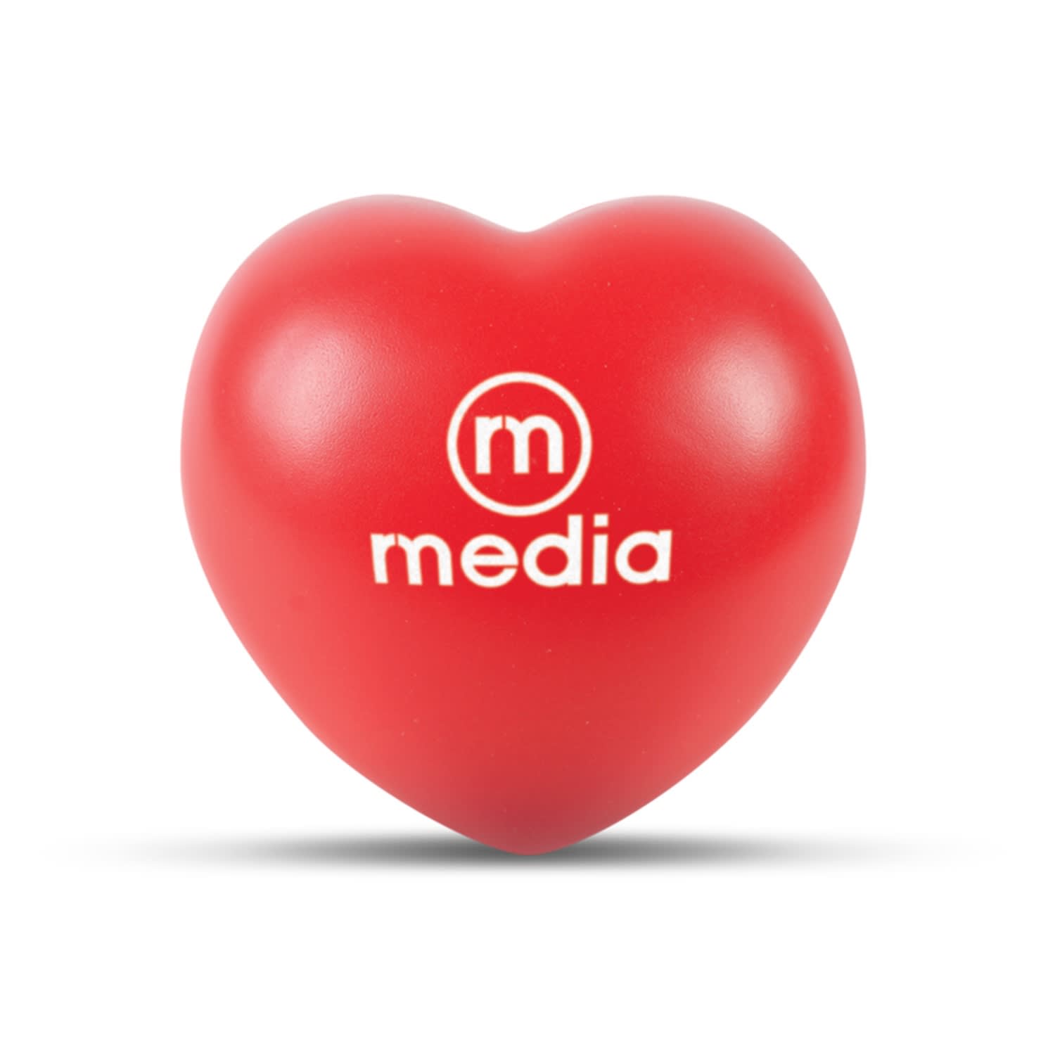 A red heart-shaped stress ball with the word "media" printed on it. Stress Heart - Image 1