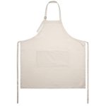 A linen apron in cream with a front pocket, featuring adjustable straps and ties at the sides.