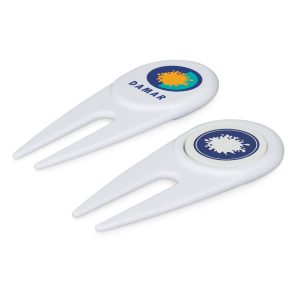 A white golf divot repairer with a marker, featuring circular designs and a logo on each side.