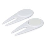 A white golf divot repairer with a built-in marker, featuring a sleek, functional design.