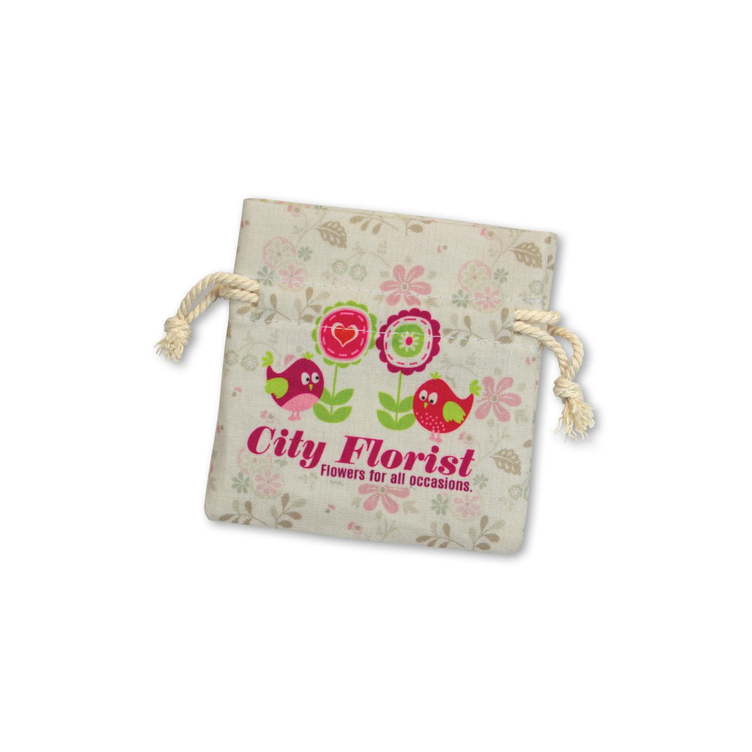 A small cotton gift bag in cream with floral designs and a drawstring closure, featuring a logo and playful bird illustrations. Turin Cotton Gift Bag - Small - Image 1