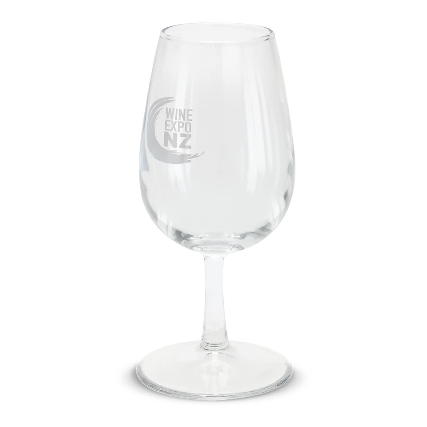 A wine taster glass featuring a clear design with the "WINE EXPO NZ" logo engraved on the side. Chateau Wine Taster Glass - Image 1