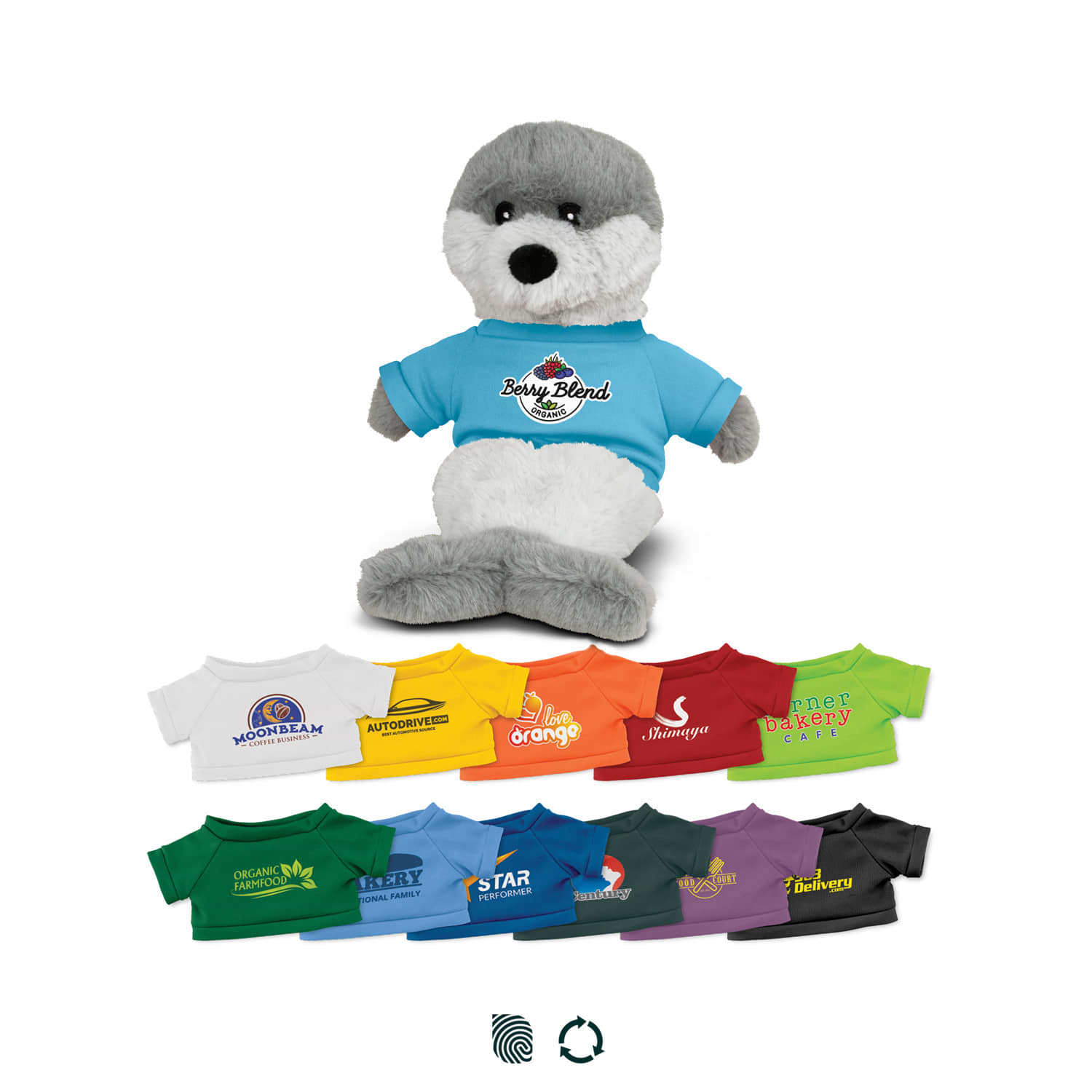 A plush seal toy with grey and white fur wearing a blue T-shirt. Various colourful miniature T-shirts are arranged below. Seal Plush Toy - Image 1