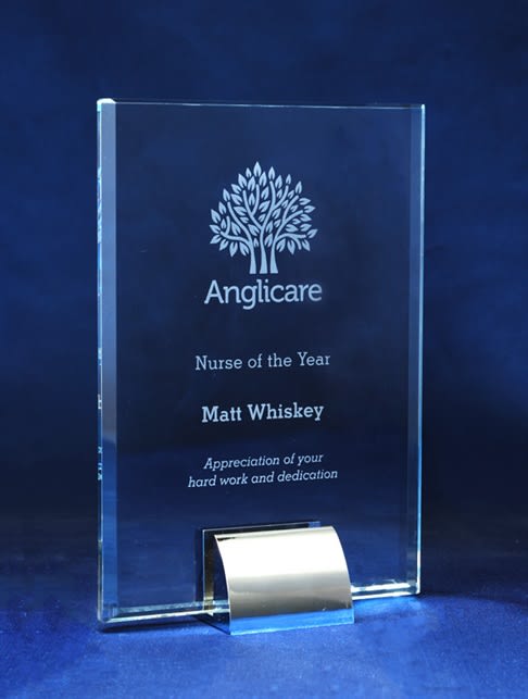 A glass award featuring a decorative tree design, with engraved text honouring "Nurse of the Year" and a name. Aspire Series Rectangle - Image 1