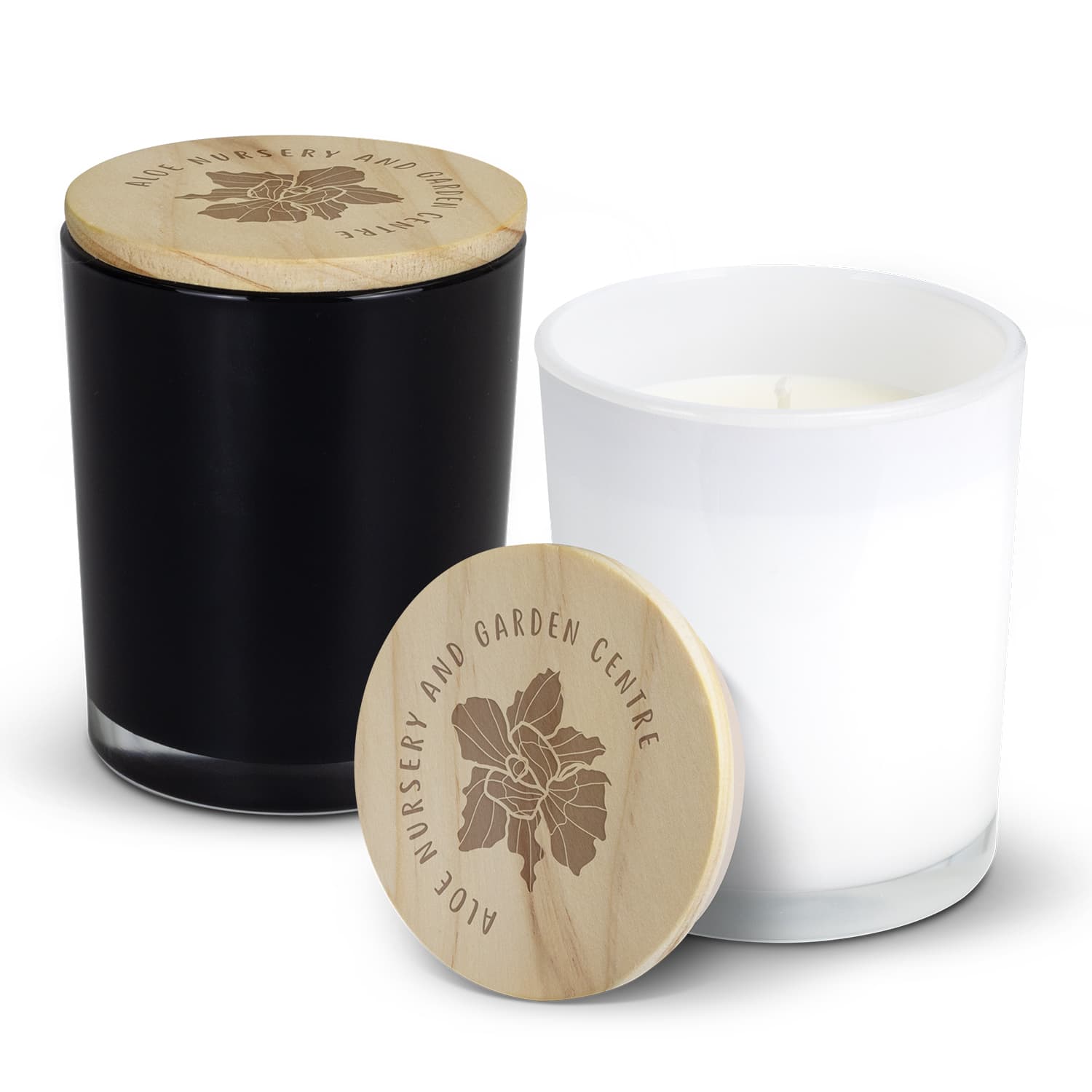 A black and a white scented candle with wooden lids, featuring engraved logos on the lids. Tranquil Scented Candle - Image 1
