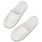 A pair of white waffle slippers with a textured surface and a soft, plush interior.