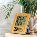 A bamboo weather station with temperature and humidity displays, featuring a wooden frame and a logo.
