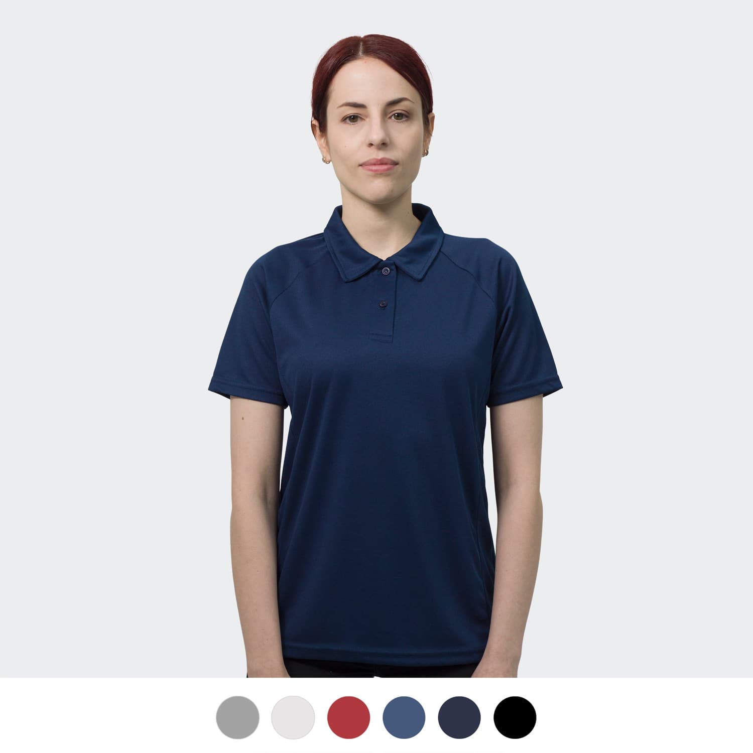A woman wearing a navy polo shirt with a collar, featuring a logo. Available in multiple colours below. TRENDSWEAR Ace Performance Women's Polo - Image 1