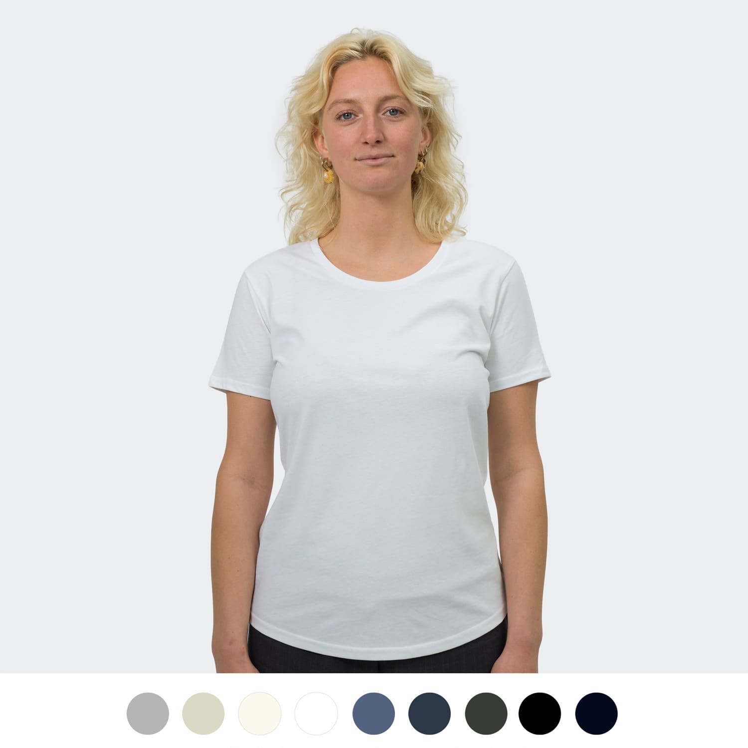 A white women's T-shirt featuring a round neck, short sleeves, and a logo. Available in various colours below. TRENDSWEAR Carmen Women's T-Shirt - Image 1