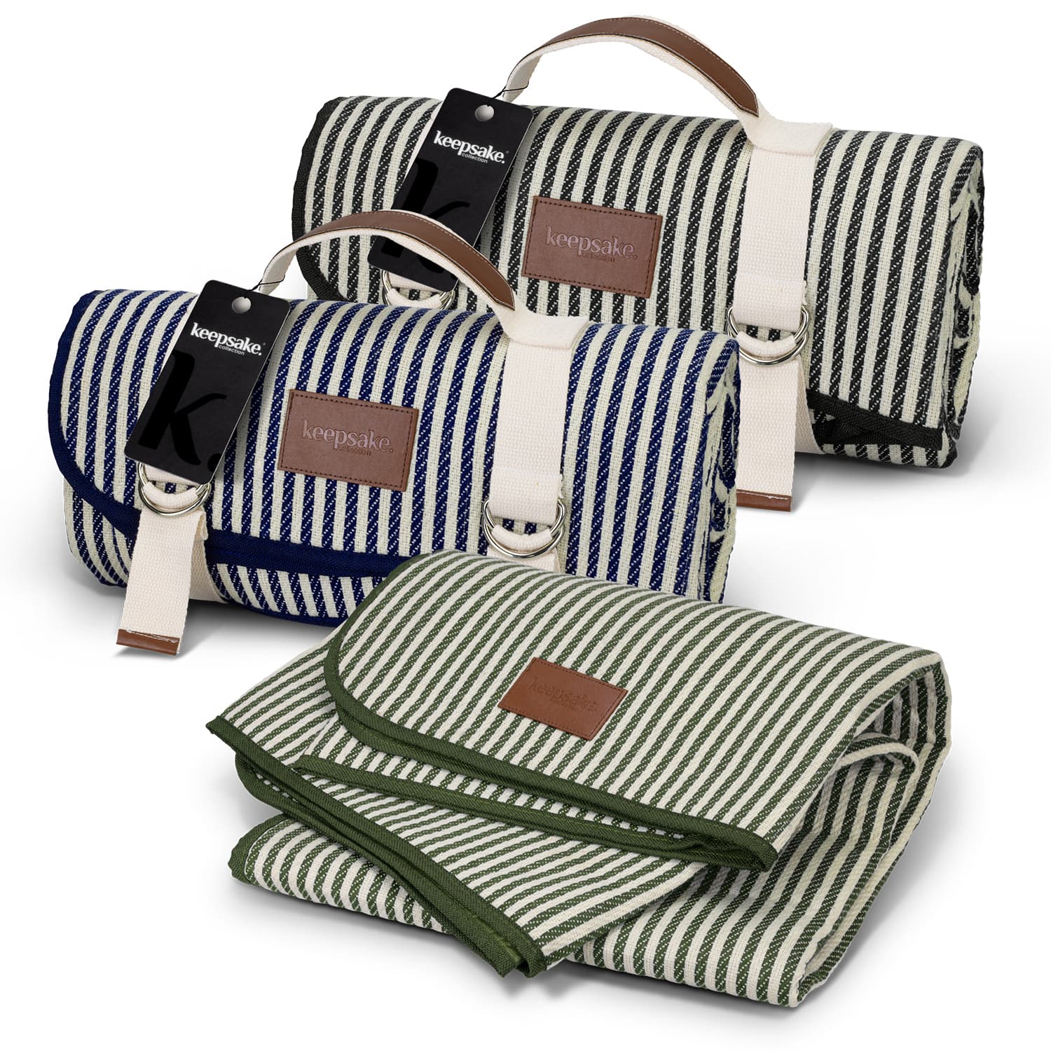A striped picnic blanket in navy blue and green, featuring leather accents and a logo. One blanket is rolled, the other unfolded. Keepsake Picnic Blanket - Image 1