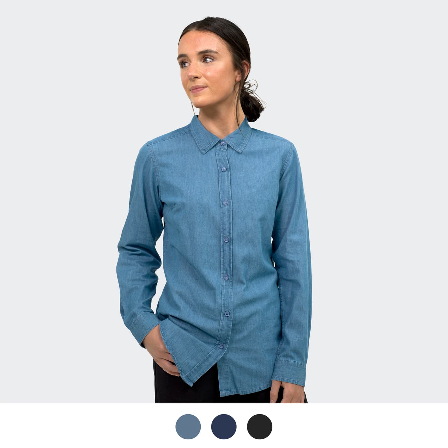 A denim button-up shirt in light blue, featuring a collar and front button closure. Includes colour options below. TRENDSWEAR Chester Women's Denim Shirt - Image 1