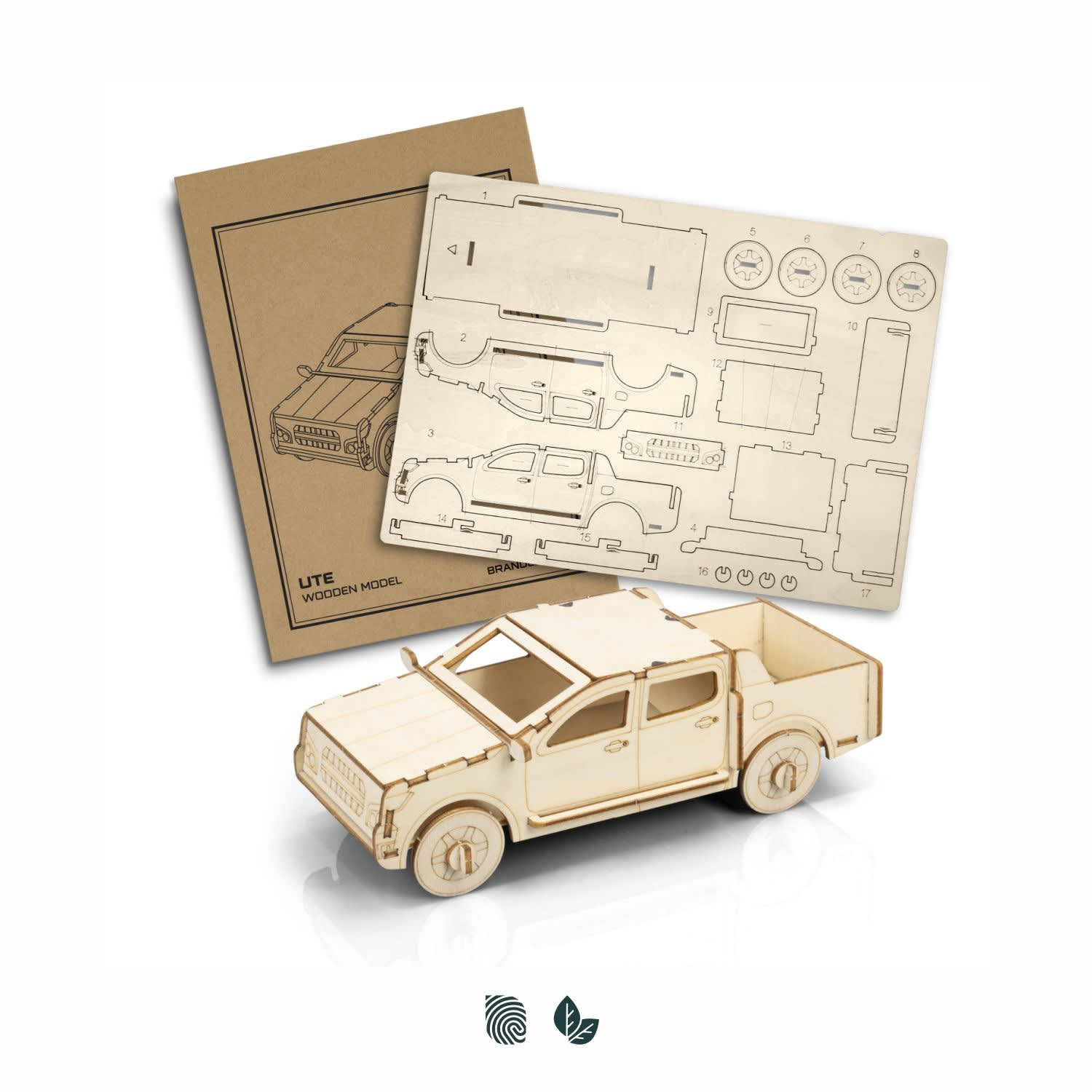 A wooden model of a UTE, featuring a detailed design in natural wood colour, accompanied by assembly instructions. BRANDCRAFT UTE Wooden Model - Image 1