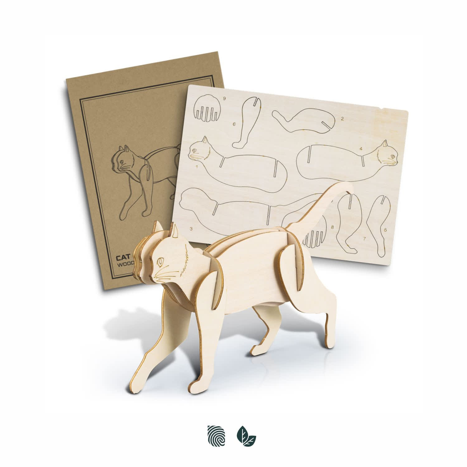 A wooden cat model in a natural finish, accompanied by instructional sheets with design outlines. BRANDCRAFT Cat Wooden Model - Image 1