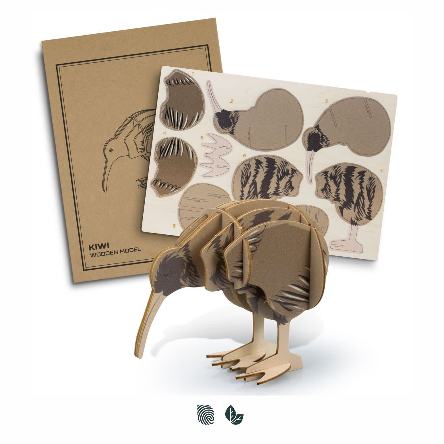 A wooden kiwi model in natural shades, with assembly pieces and a design template in the background. Contains a logo. BRANDCRAFT Kiwi Wooden Model - Image 1