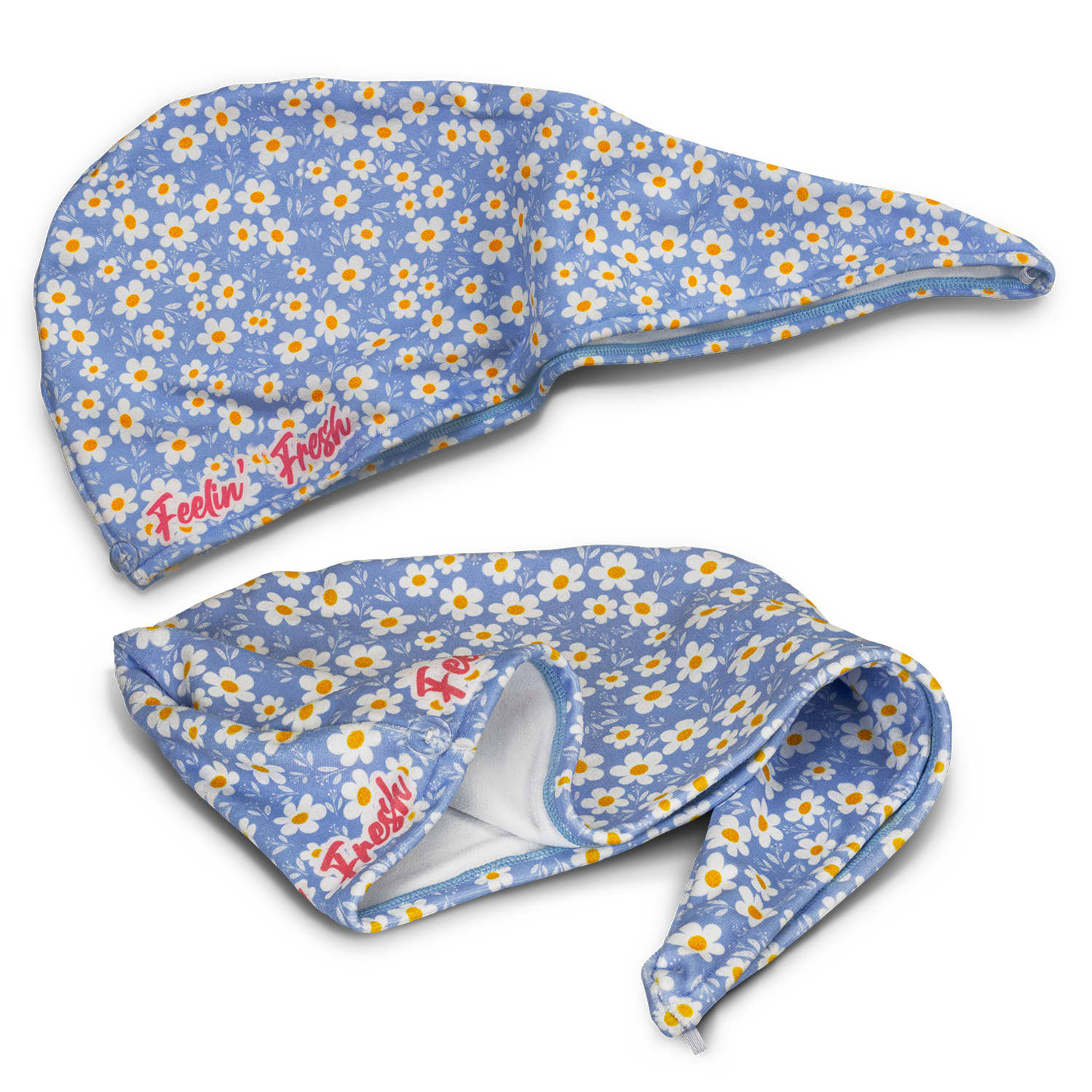 A blue floral hair towel with a pointed hood and a logo, featuring white daisies and yellow accents. Sabina Hair Towel - Image 1