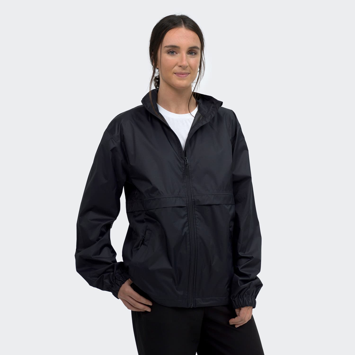 A unisex windbreaker jacket in black featuring a zip front and elastic cuffs, styled with a relaxed fit. TRENDSWEAR Wellington Unisex Windbreaker - Image 1