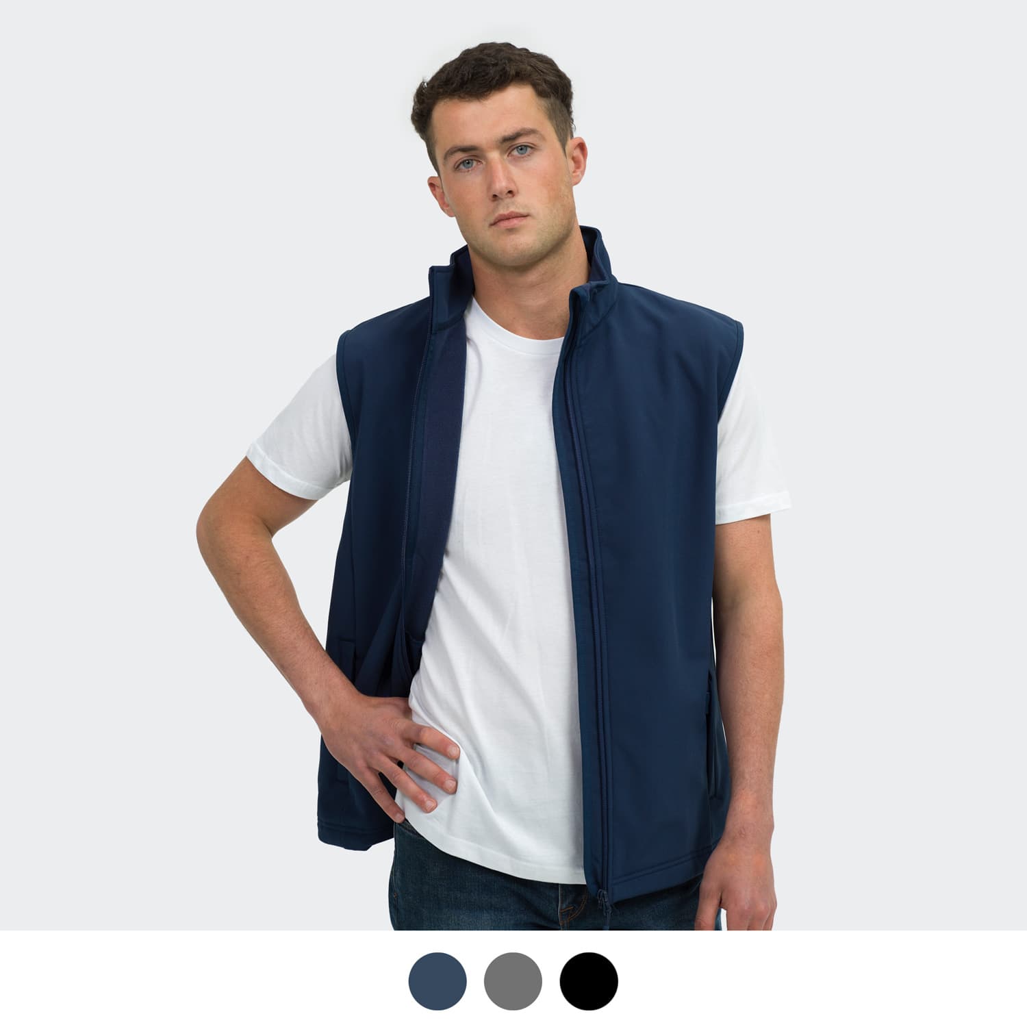 A navy men's vest without sleeves, featuring a front zip and a collar, modelled by a person. Includes a logo. TRENDSWEAR Hudson Mens Vest - Image 1