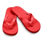 Red flip flops with a textured sole and matching straps, featuring a logo on the side.