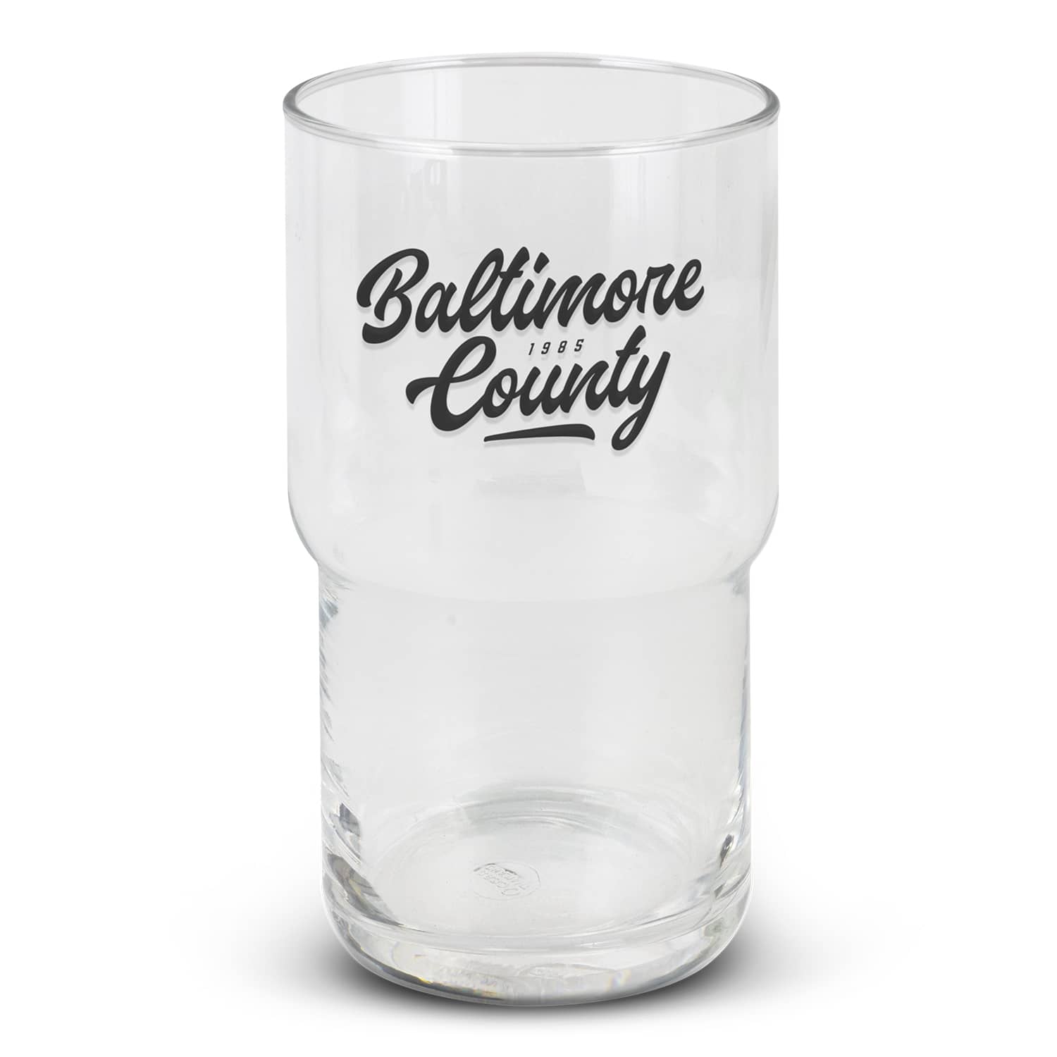 A clear stackable glass tumbler featuring a black logo. The glass has a cylindrical shape with a wider base. Deco Stackable Glass - 630ml - Image 1