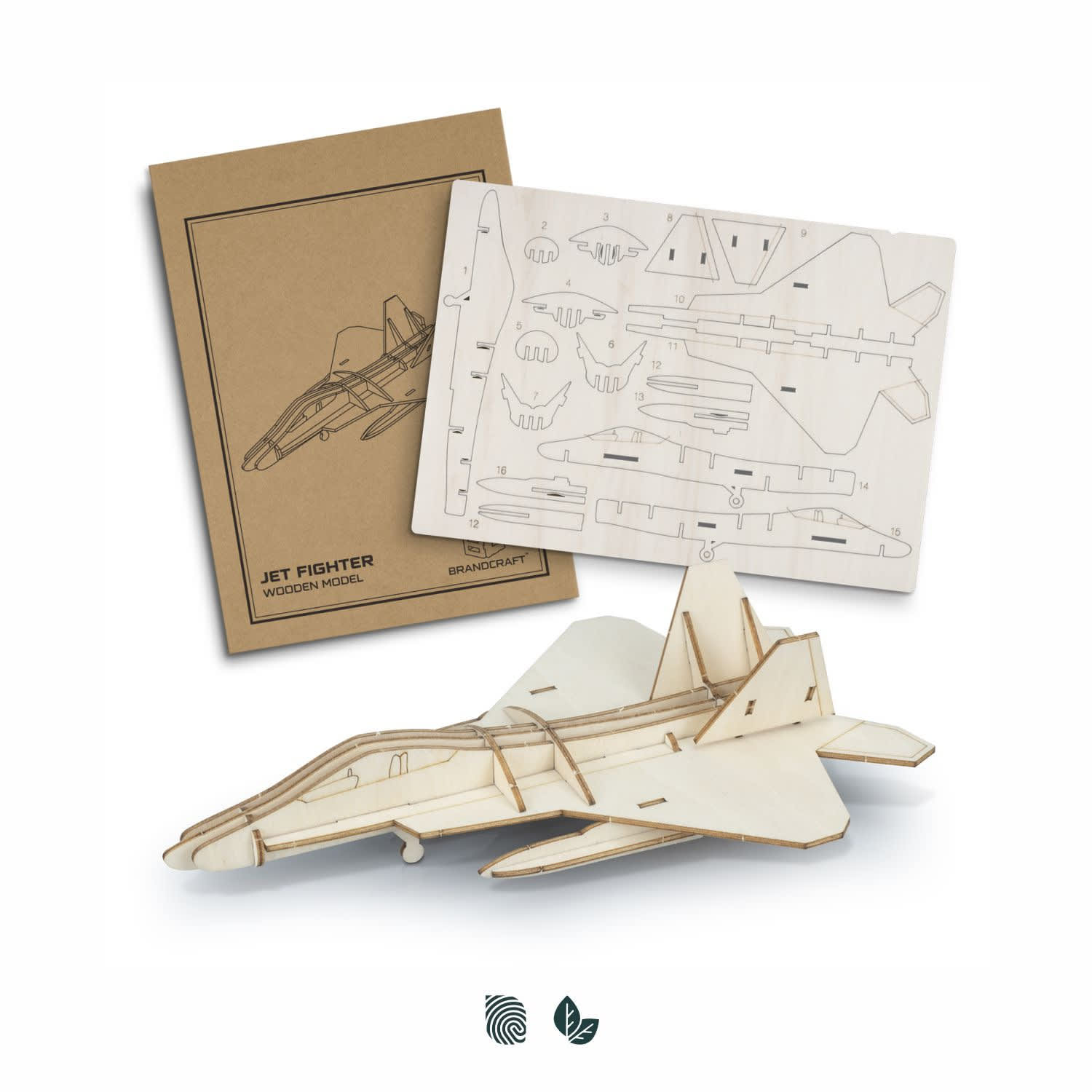 A wooden model of a jet fighter in natural wood colour, accompanied by the assembly template and instructions. BRANDCRAFT Jet Fighter Wooden Model - Image 1