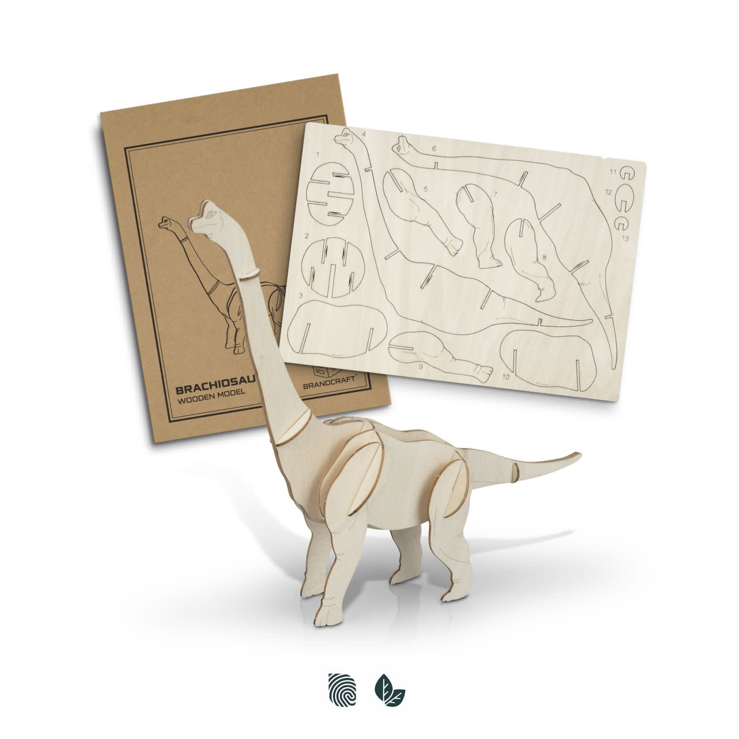 A Brachiosaurus wooden model in natural wood colour, with assembly pieces and packaging displayed behind. BRANDCRAFT Brachiosaurus Wooden Model - Image 1