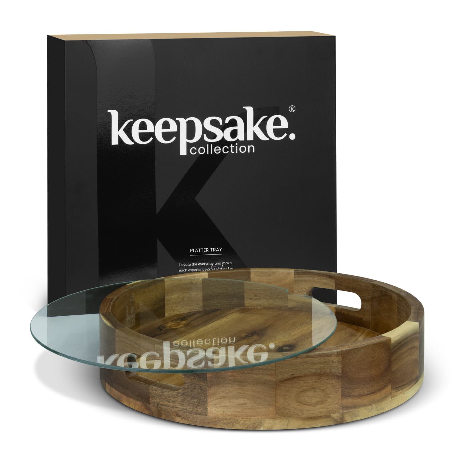A wooden platter tray with a glass top, presented in a black branded box. The tray features a circular design. Keepsake Platter Tray - Image 1
