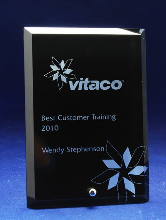 A glass rectangle award in black with a floral design and engraved text. It features a small silver embellishment. 10mm Glass-Rectangle - Laser Engraved - Image 1