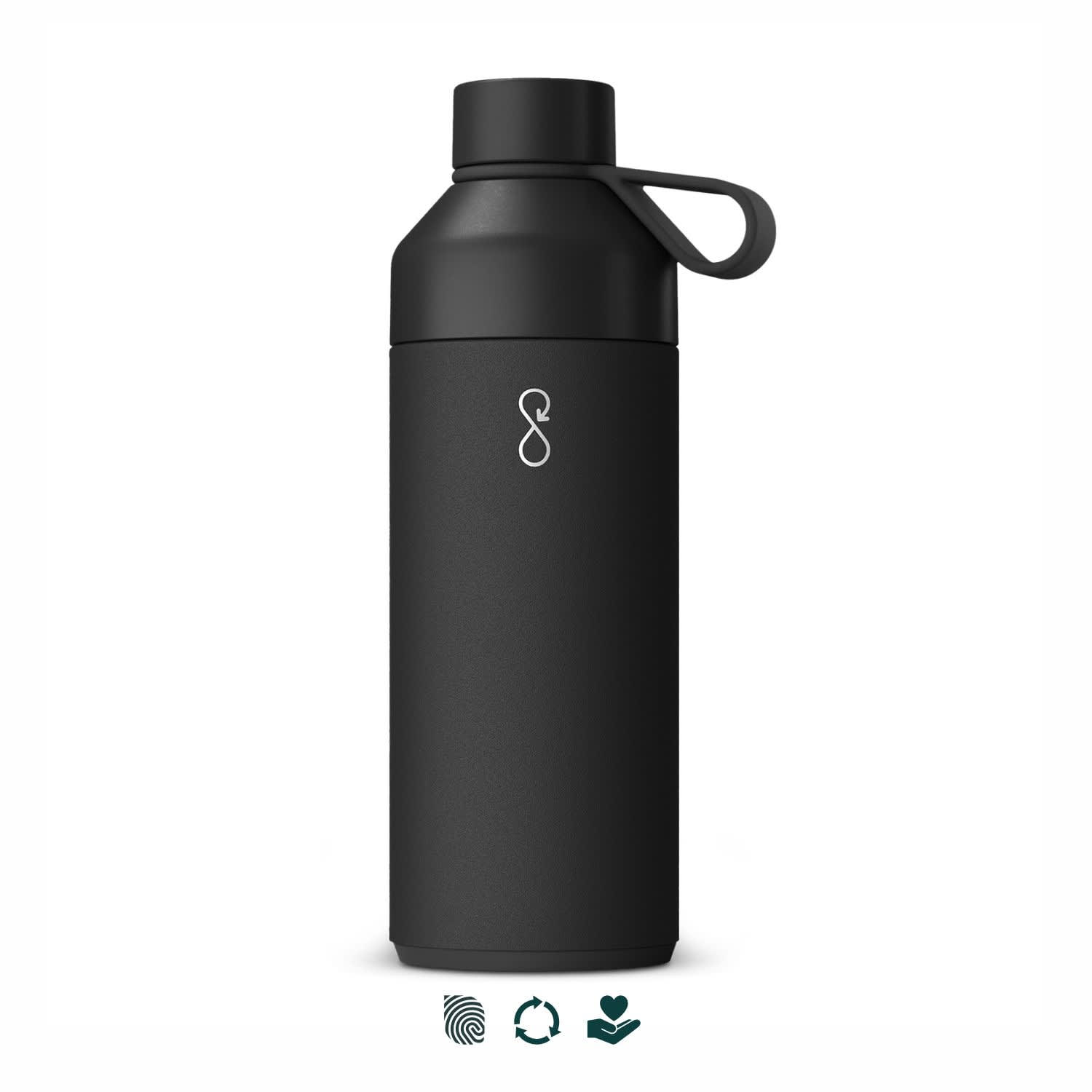 A drink bottle in matte black with a screw-on lid and a holding loop. It features a logo on the front. Ocean Bottle Big Vacuum Bottle - Image 1