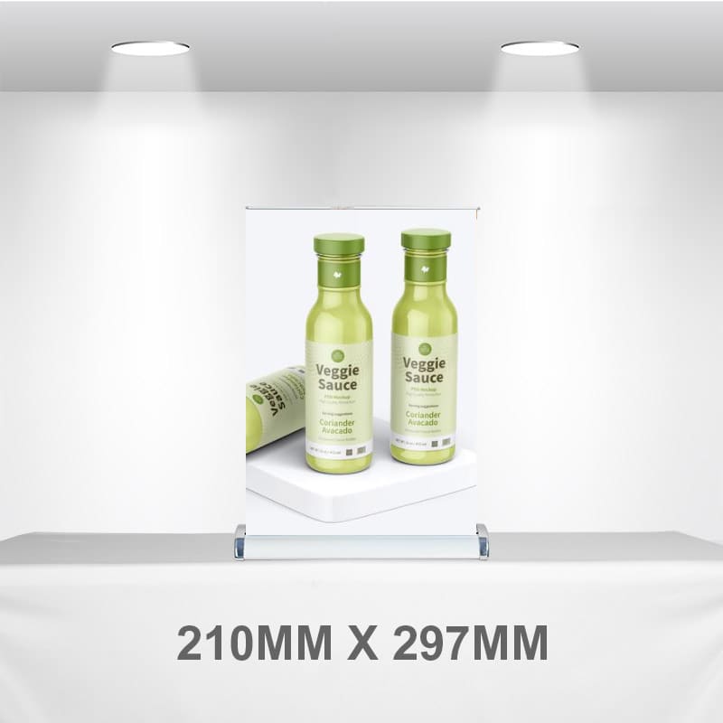 A pull-up banner displaying two green bottles of Veggie Sauce, set against a neutral background. A4 Counter Top Pull Up Banner - Image 1