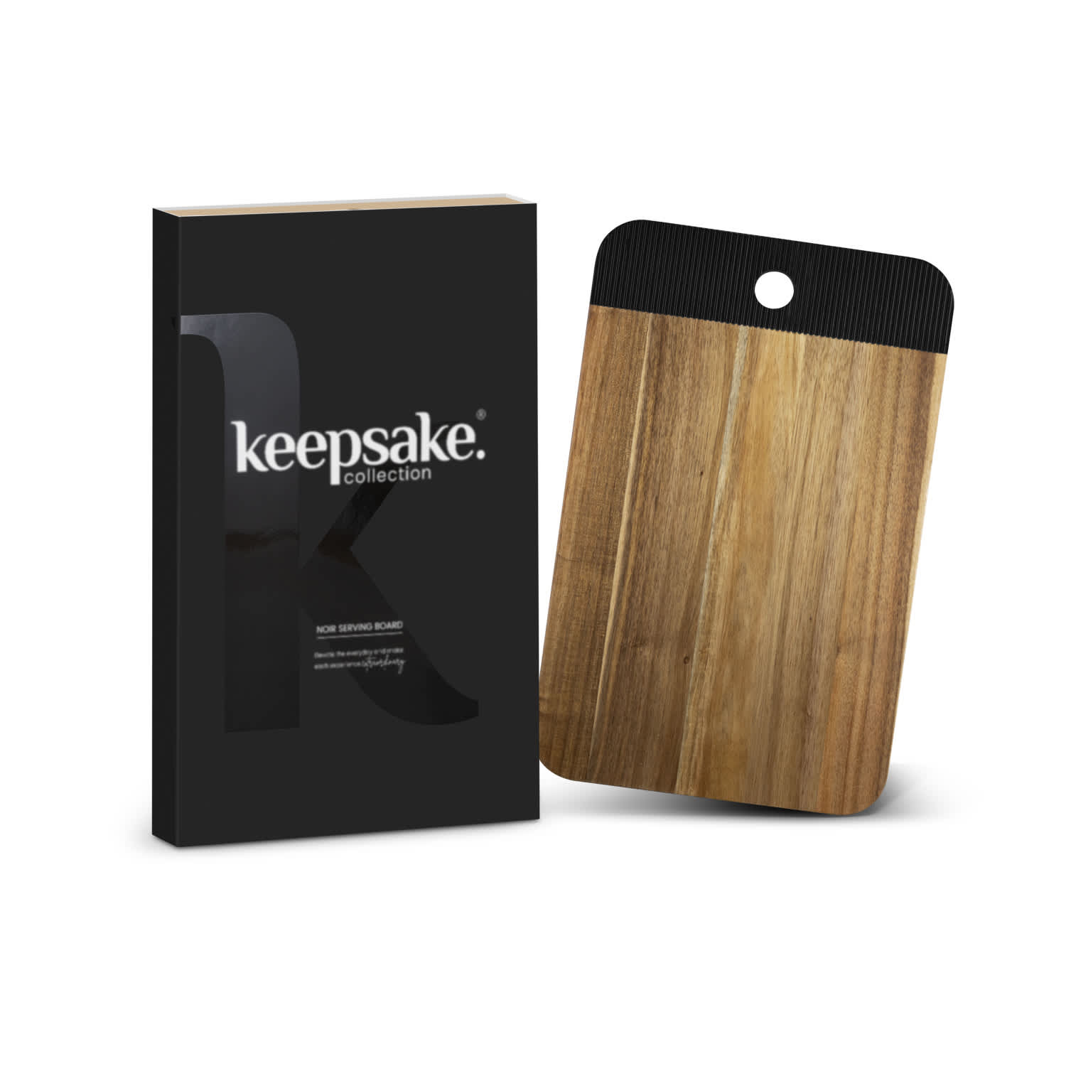 A wooden serving board with a black accent, packaged in a sleek black box featuring a logo. Keepsake Noir Serving Board - Image 1