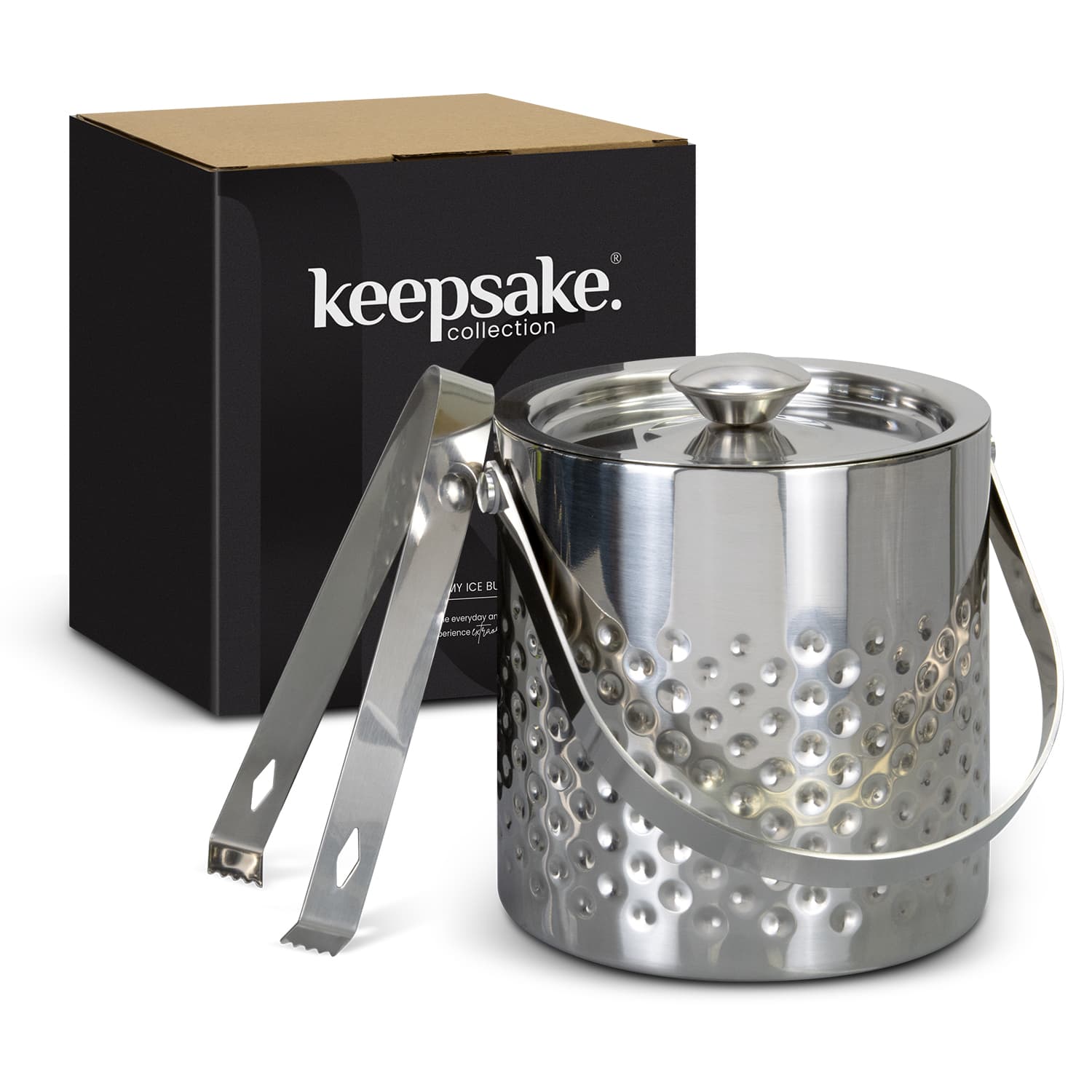 A sleek silver ice bucket with a dotted design, accompanied by tongs, packaged in a black box featuring a logo. Keepsake Alchemy Ice Bucket - Image 1