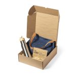 A gift box containing a stainless steel drink bottle, a denim tote bag, and a branded card, arranged with straw filling.