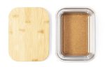 A transparent container with a bamboo lid, featuring a light brown substance inside.