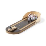 A wooden bowling minigame set featuring a lane, seven white pins with red stripes, and a black bowling ball.