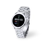 A silver smart watch with a metal band displaying fitness metrics and time. It features a logo on the dial.