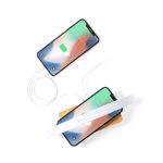 A wireless charger in a wooden base with two smartphones charging, featuring a sleek white design.