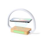 A wireless charger with a bamboo base and a white arch design, featuring a smartphone hovering above.