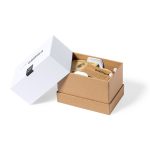 A white box containing a brown cardboard inner box, featuring a wireless charger holder and additional accessories.