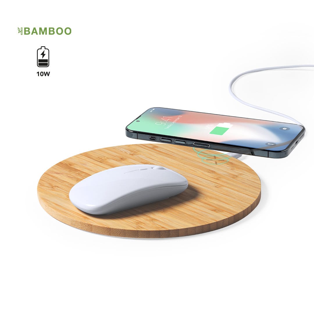 A wireless charger mousepad in natural bamboo with a white mouse and smartphone charging on it. A wireless charger mousepad in natural bamboo with a white mouse and smartphone charging on it.