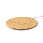 A round bamboo mousepad with a white charging cable, designed for wireless charging.