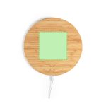 A round wooden mousepad with a green charging area in the centre, featuring a connected cable.
