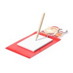 A red magnetic notepad featuring a Santa and reindeer design, with a wooden pencil on top.