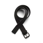 A black cotton webbing belt laid out flat, featuring a metal buckle and several adjustment holes.