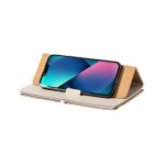 A cork notebook holder with a smartphone propped up, featuring a beige notebook and a sleek design.