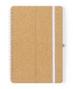 A cork-covered spiral notebook with a white elastic band. It features a simple, natural design.