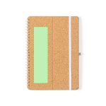 A cork-covered notebook with a white elastic closure and a green rectangular section. It features a branded logo.