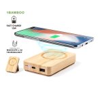 A bamboo power bank with a wireless charging pad and a smartphone, featuring USB-C and USB ports.
