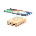 A wooden power bank with wireless charging capabilities, featuring a smartphone positioned above it.