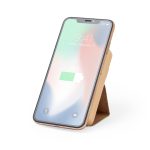 A smartphone with a wood-grain case, displaying a battery icon, resting on a stand. The screen shows a blurred background.